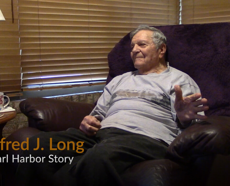 Al Long sits in his chair and recounts stories of WW2